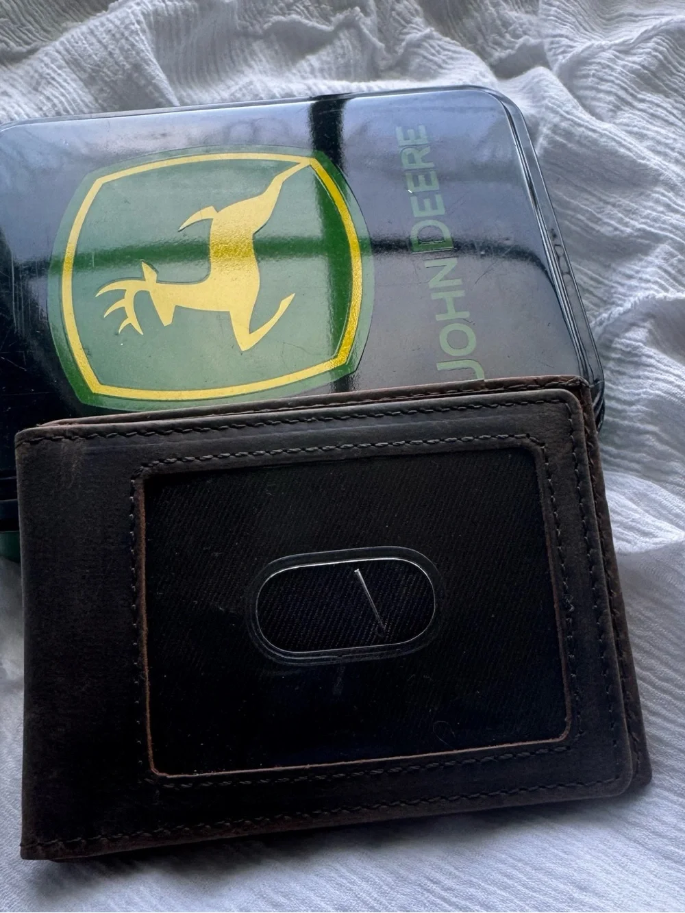 John Deere genuine leather money clip wallet in its original collectible tin.